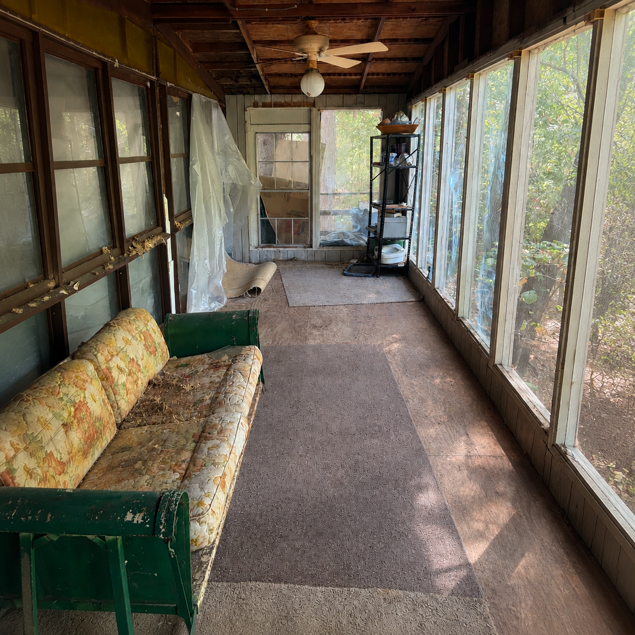 Screened porch after The Junk Unit NWA removed the unwanted items and cleared the walkway